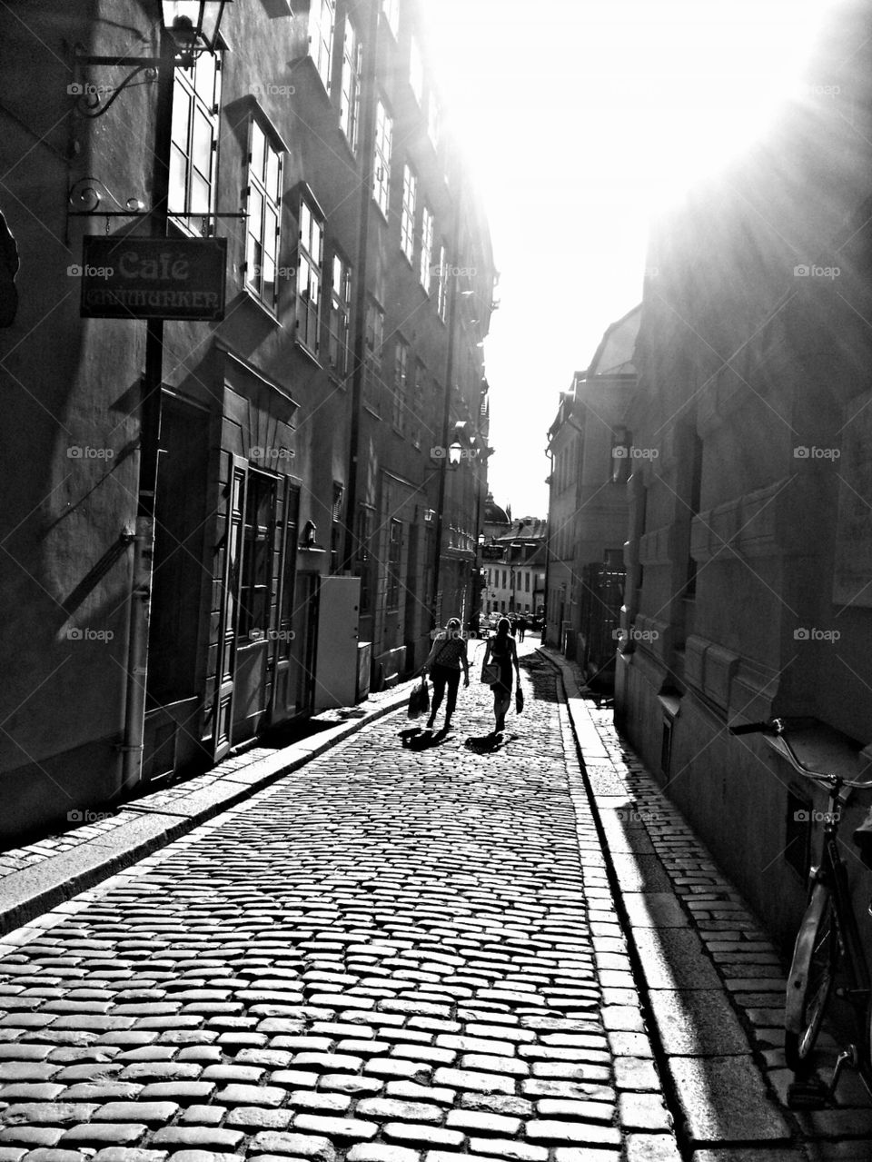 Two women walking in the old city of Stockholm