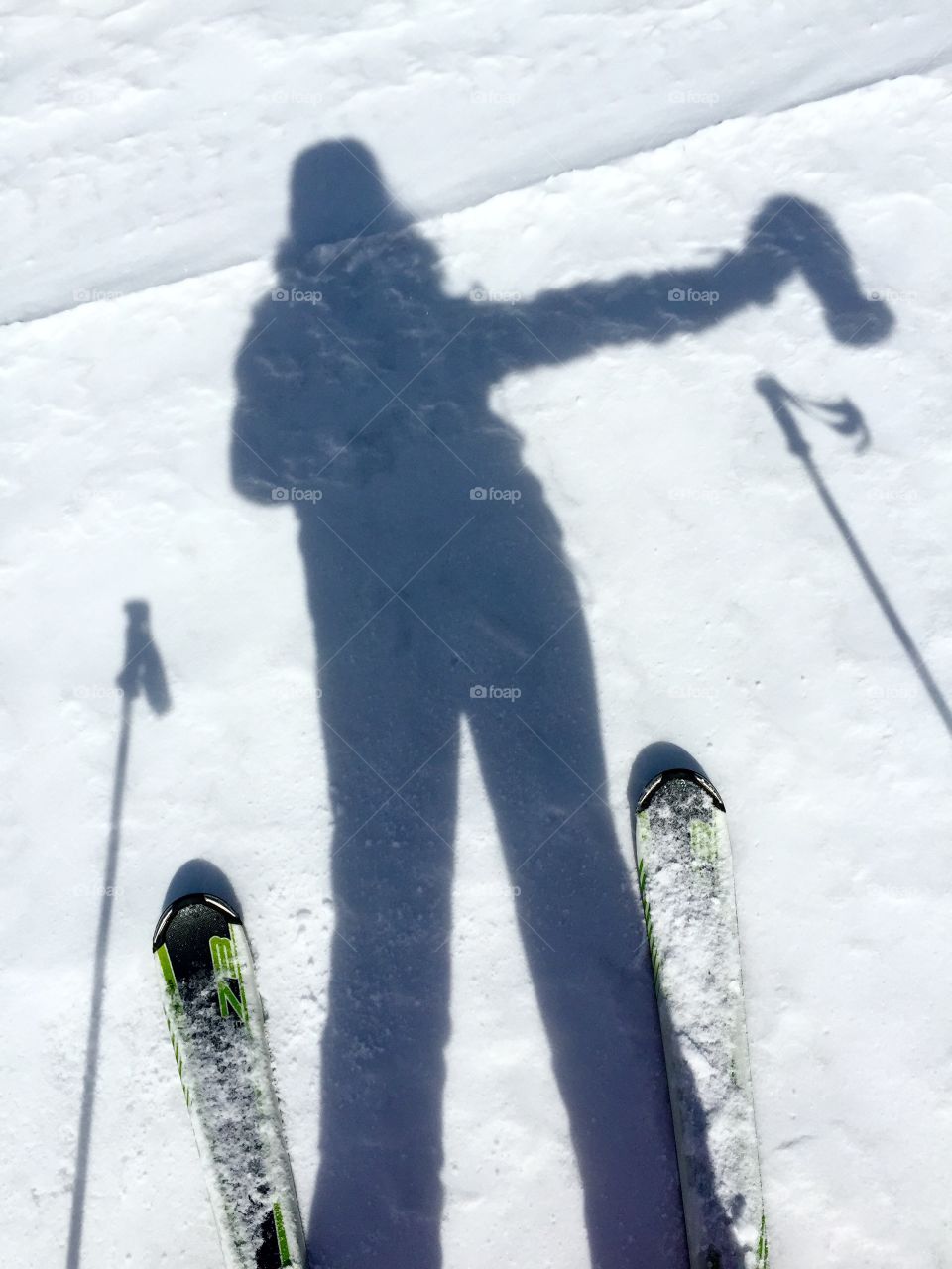 Shadow of skier on the snow