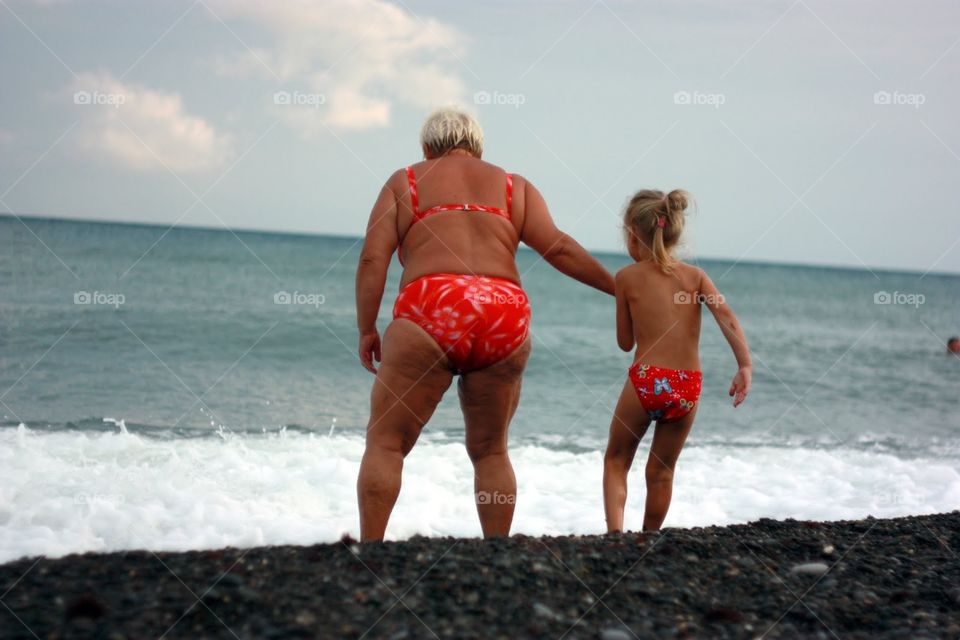 Girl with granny in the sea