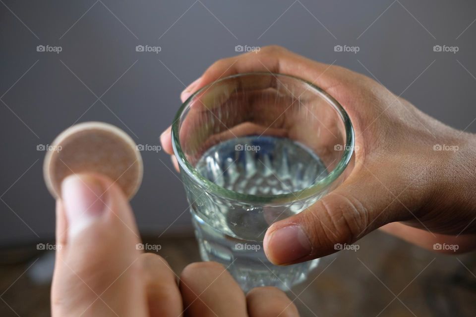 Tablets and glass of water