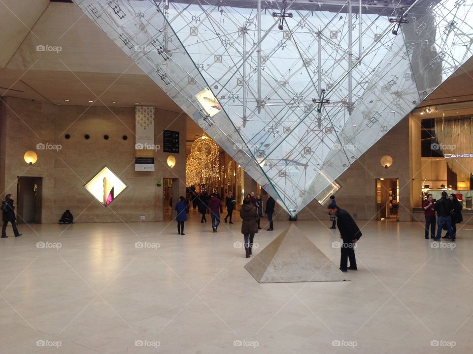 At the louvre . At the bottom of the glas pyramid in louvre Paris 