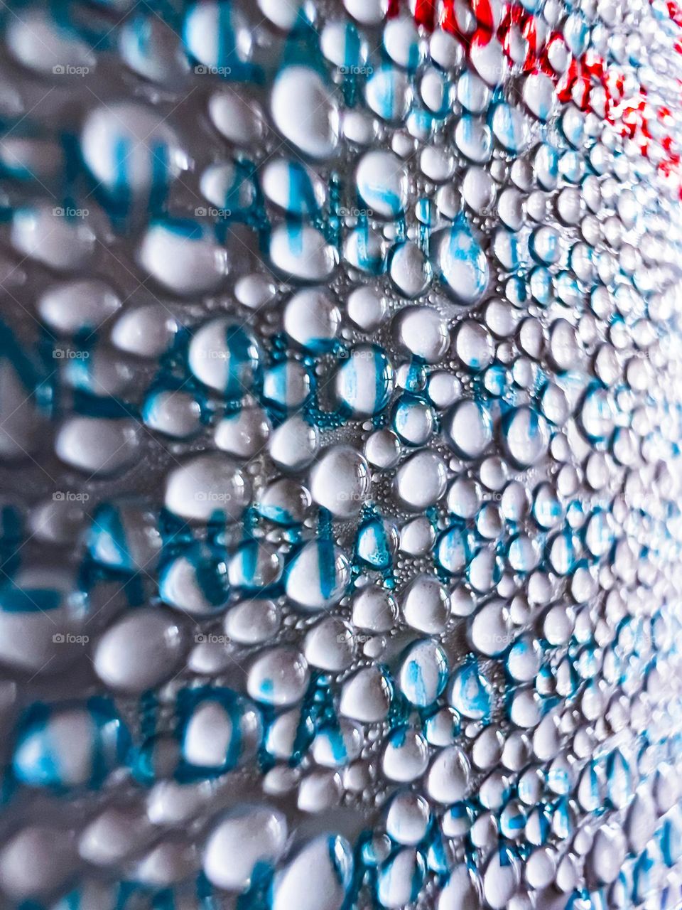 Close up photo of water droplets on a can of cold drink.