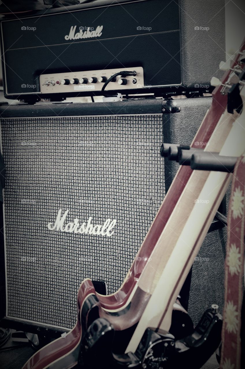 Marshall head and amp with guitars