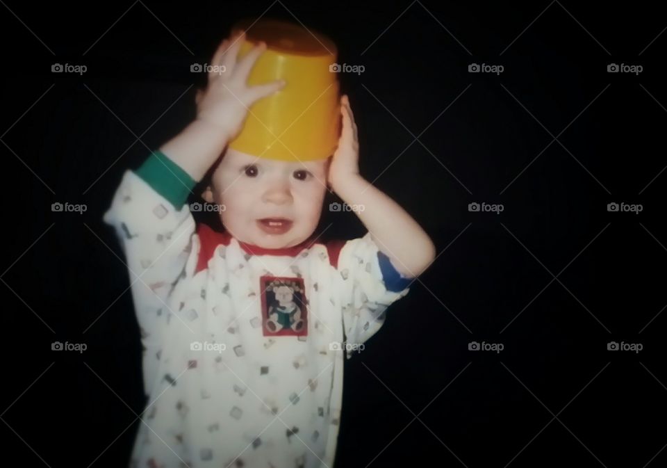 Baby with a Bucket on his Head