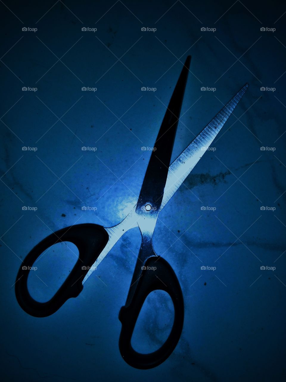 paper scissors with blue light