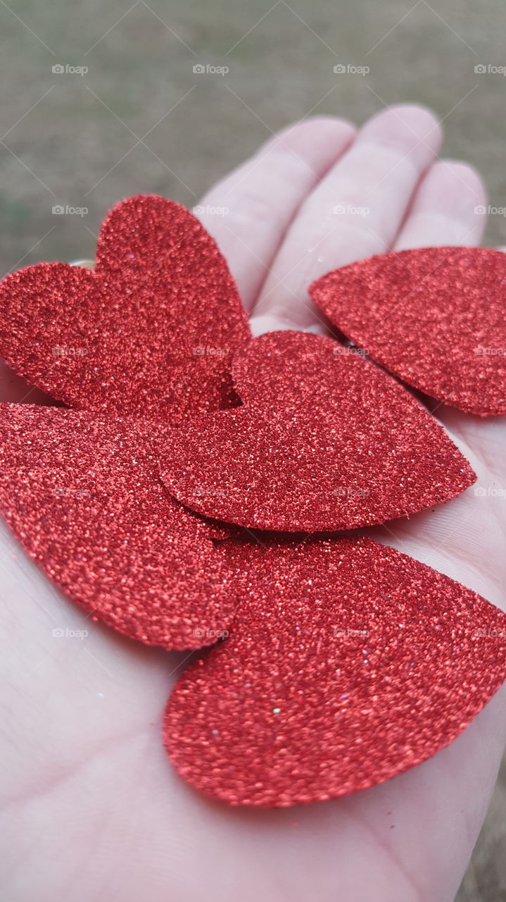 Holding Red Hearts