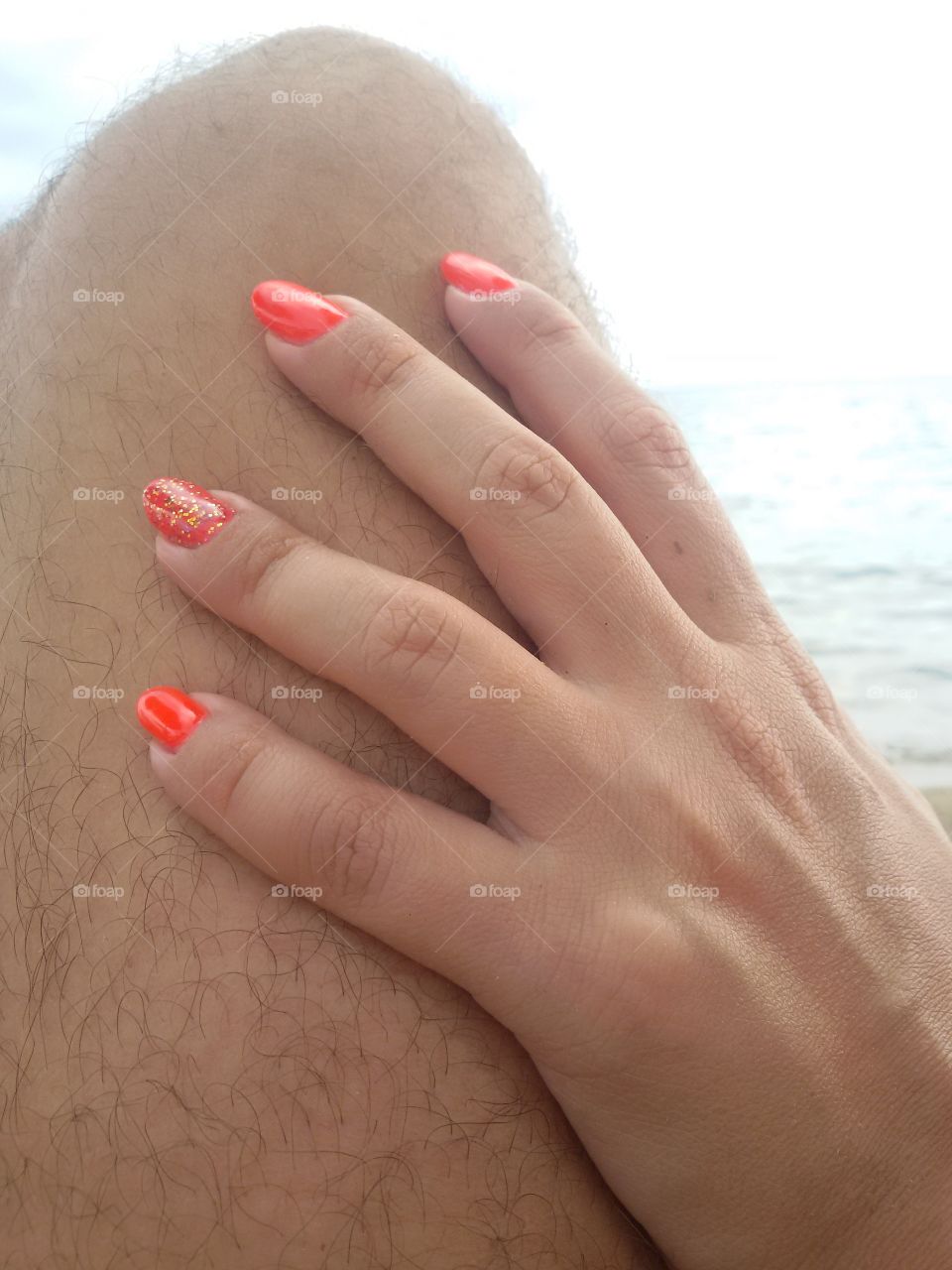 Female nails on gentlemans leg