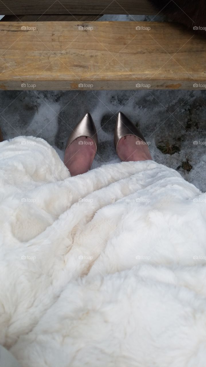 Shoes on snow at an outdoor winter wedding