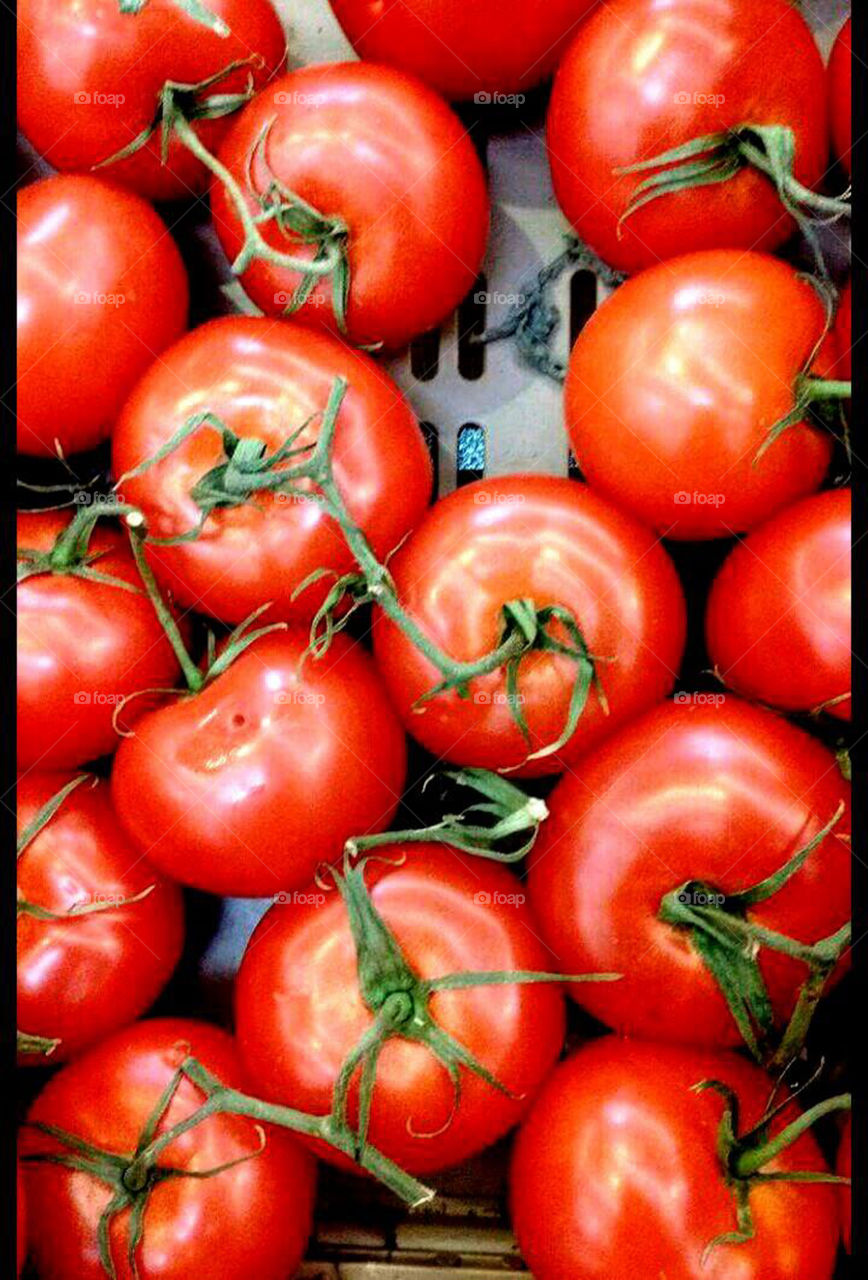 Red juicy tomatoes.Tomatoes  are rich in lycopene that prevents heart illnesses.