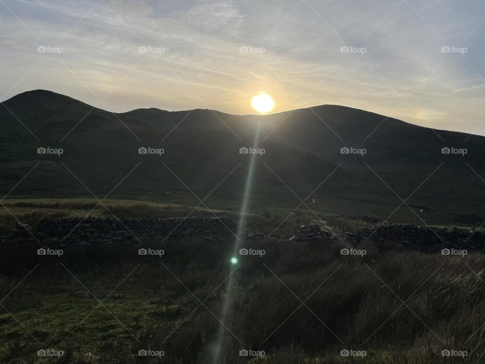 Descending Snowdon as the sun goes down 