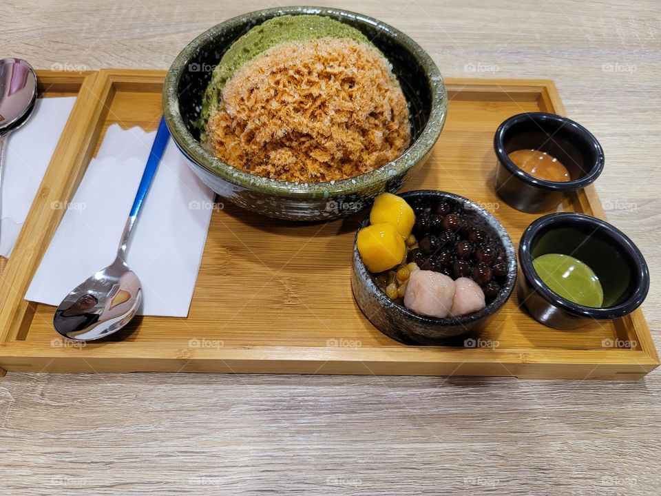 Two-color shaved ice with taro balls, sweet potato balls, and tapioca ball (or boba) toppings