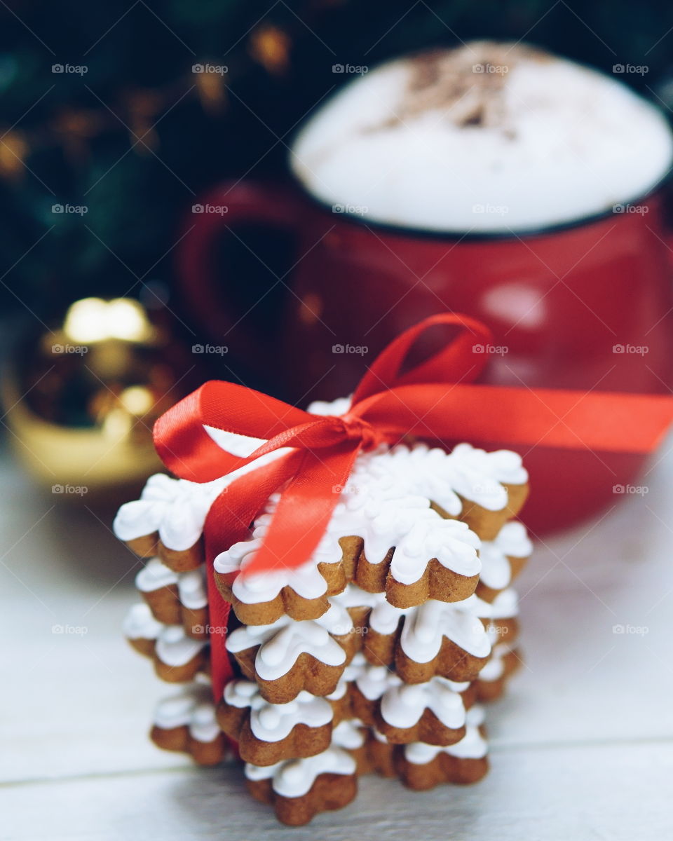 Close-up of gingerbread and hot chocolate