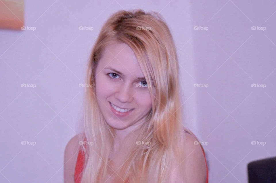 A portrait of young blond woman, smiling