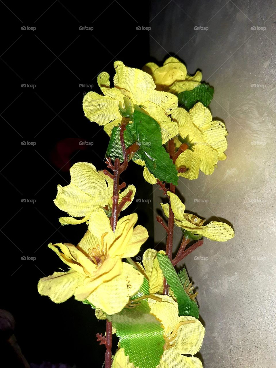 A beautiful arrangement of yellow roses in a vase, radiating warmth and elegance, perfect for home or event decor in Casablanca on January 1, 2025. The soft petals of the roses add a touch of vibrancy, complementing the serene atmosphere