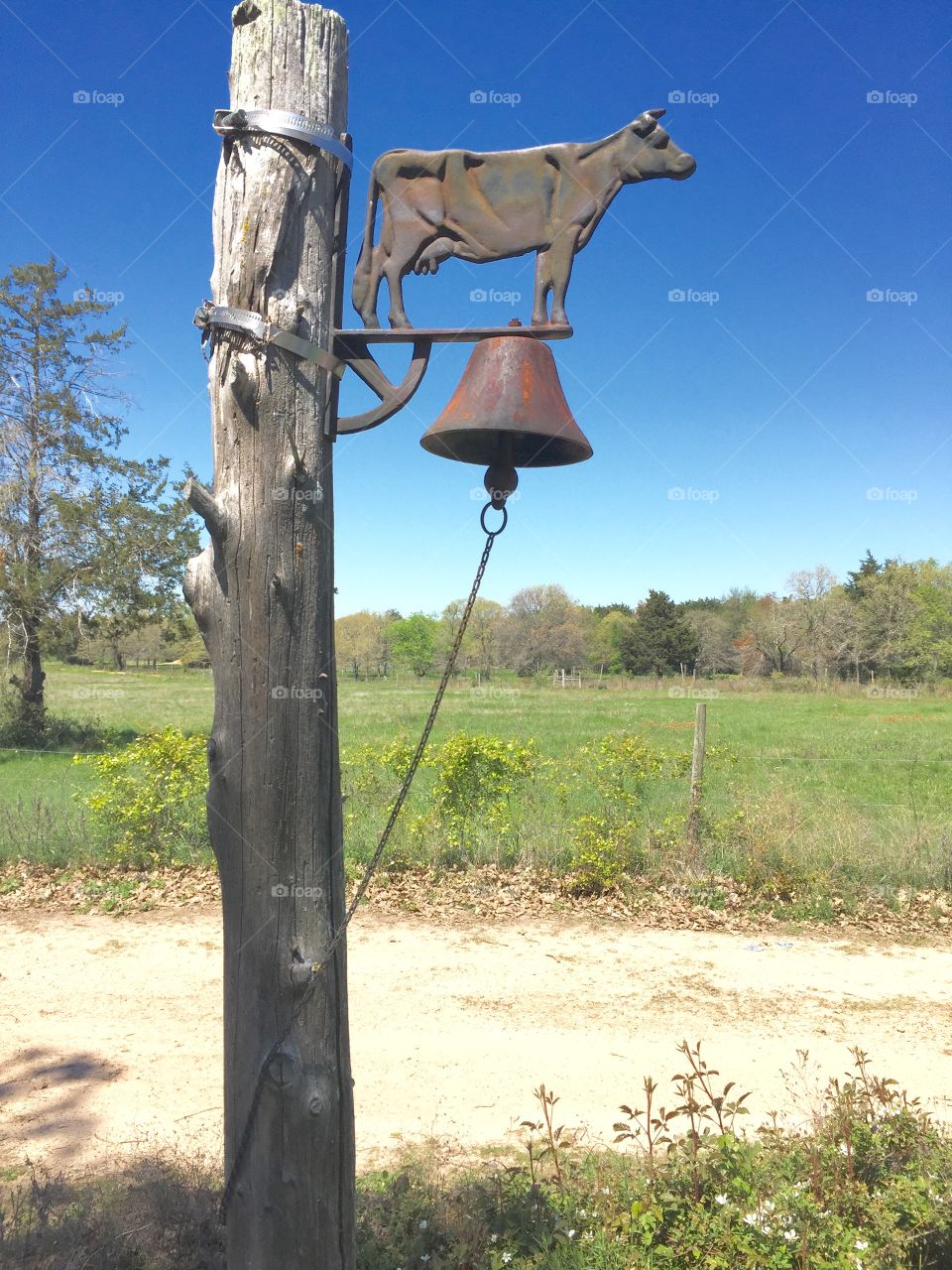 Cow bell on a post that you can ring when dinner is done