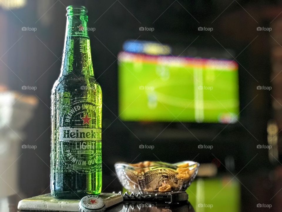 Heineken beer, tv and snacks