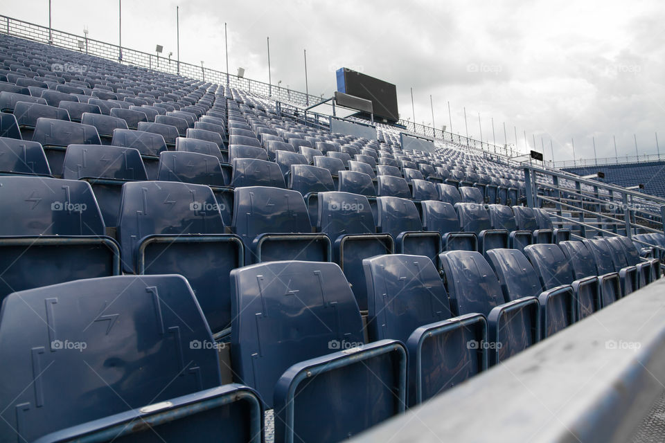 Empty blue bleachers in the stadium