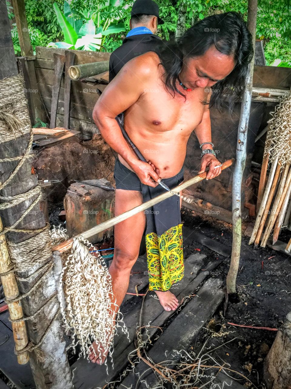 A native working with his tools