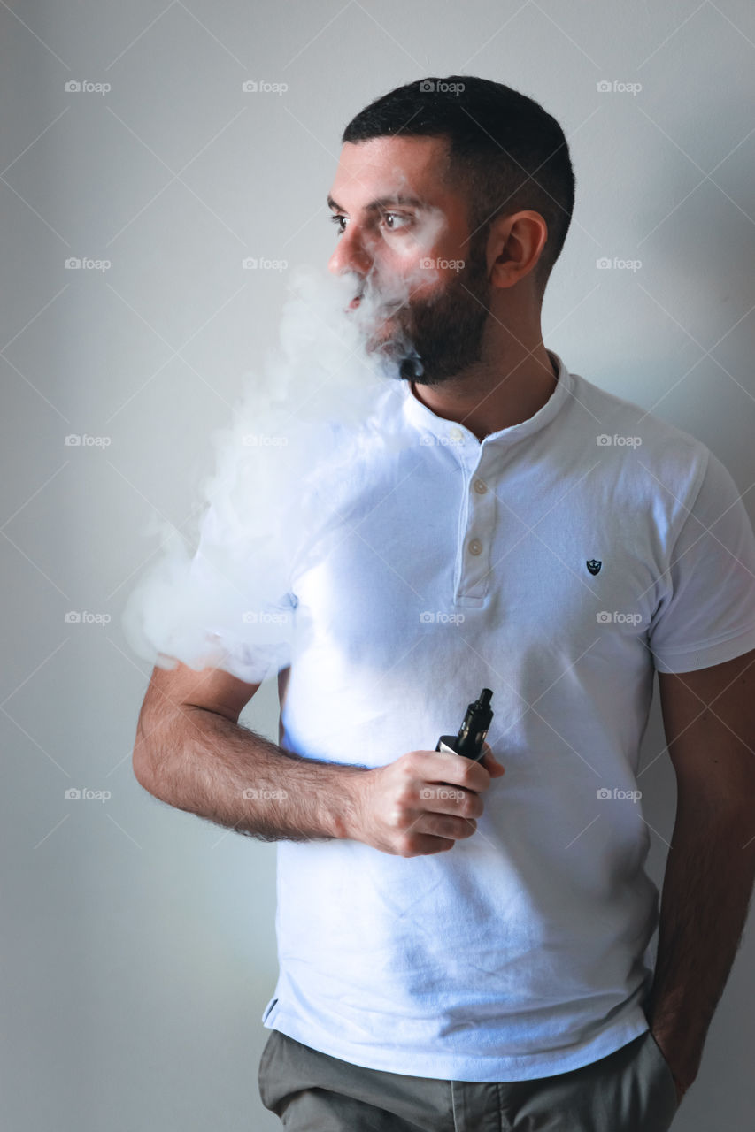 Man smoking while relaxed at home