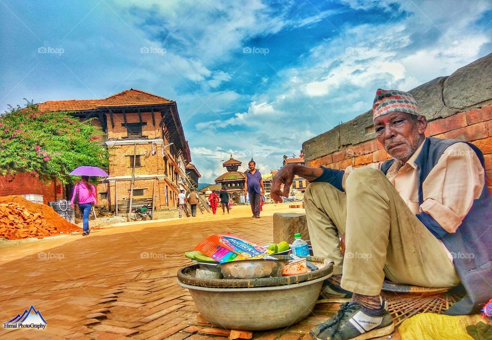 old man selling nepali stuffs for his living hood .. bhaktapur dubar square ..listed in world heritage site by UNISECO