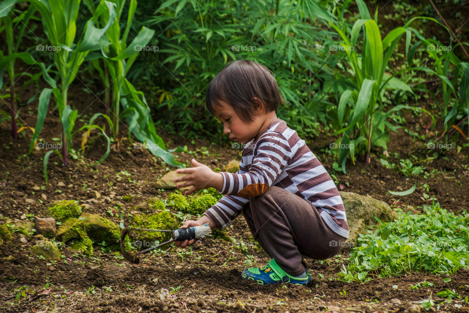 On this day of world environment day, this little kid is learning to take care of mother nature. Learning gardening at an early stage.