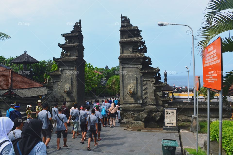 This photo was taken when traveling to Tanah Lot, Bali, Indonesia.

Pura Tanah Lot is a tourist attraction in Bali, Indonesia. Here are two temples located on a boulder. One is located on a stone boulder and the other is located on a cliff similar to Pura Uluwatu. This Tanah Lot Temple is part of Dang Kahyangan temple. Pura Tanah Lot is a sea temple where the worship of the gods of the sea guard. Tanah Lot is famous as a beautiful place to see the sunset.
Wikipedia