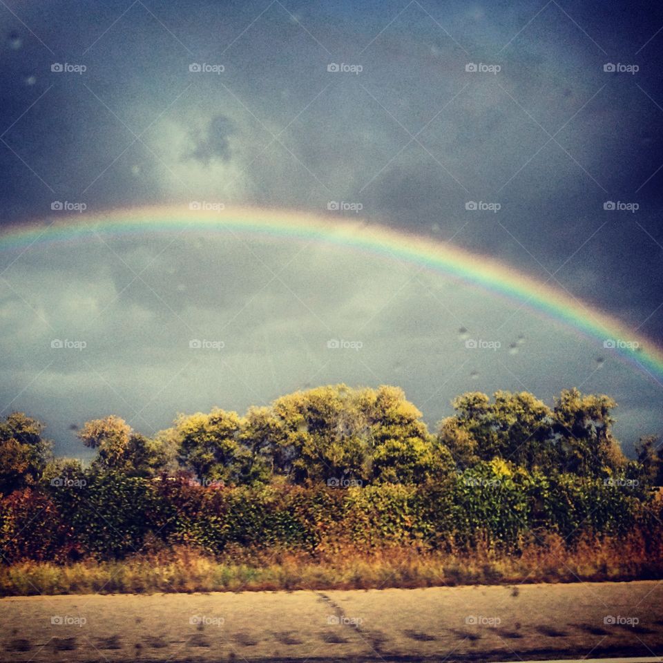 Stormy Beauty. I took this picture on my way to Madison WI after a wicked storm subsided. An amazing rainbow was revealed.