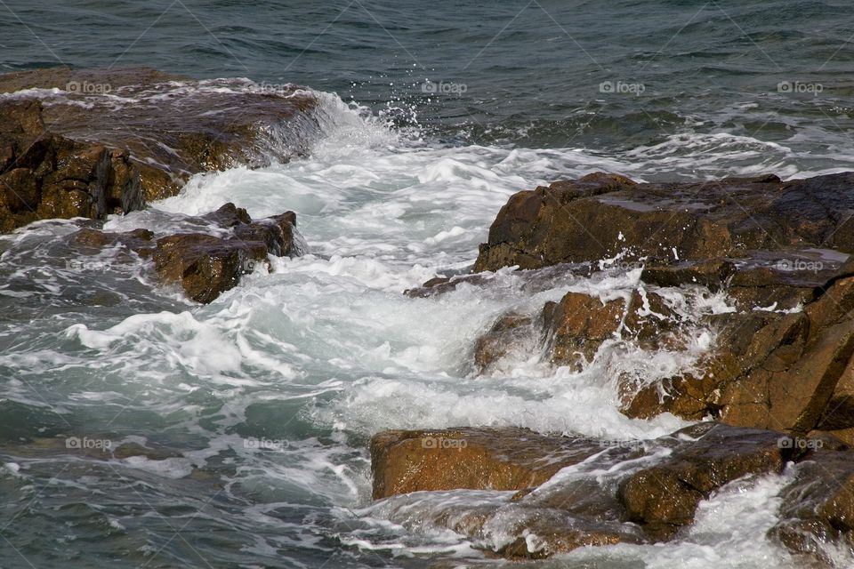 waves crashing on rocks