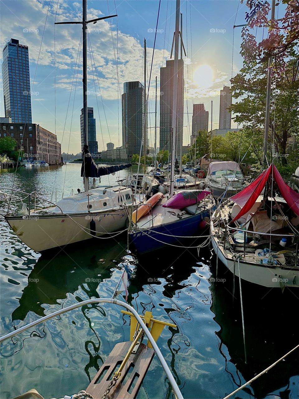 This is picturesque “Newtown Creek” with its great variety of boats seen from aboard “Salvation”, a “28 ft 1969 Luhrs” cabin cruiser by the “Pulaski Bridge” in LIC, Queens on a sunny evening in May 2024. Hypnotic Productions