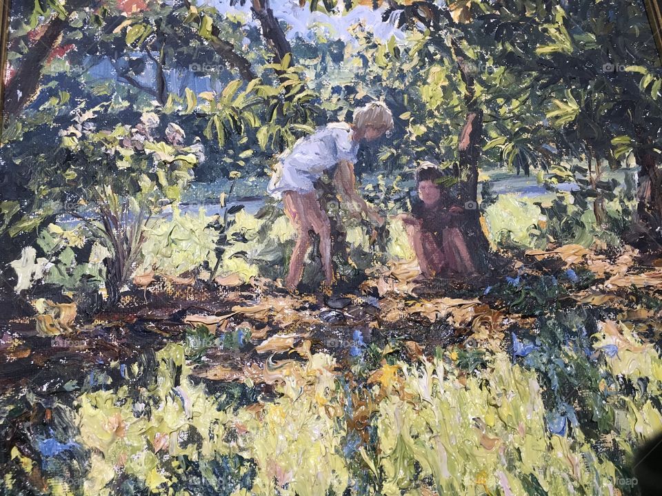 Oil painting sitting under the tree