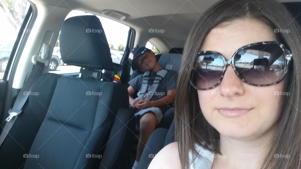 car selfie with sleeping boy
