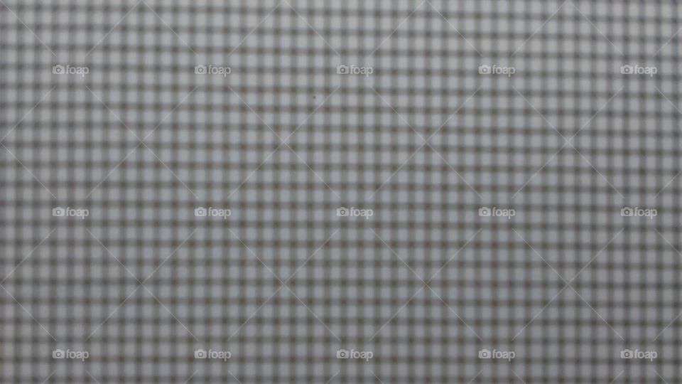 Macro of the mesh of a screen door.