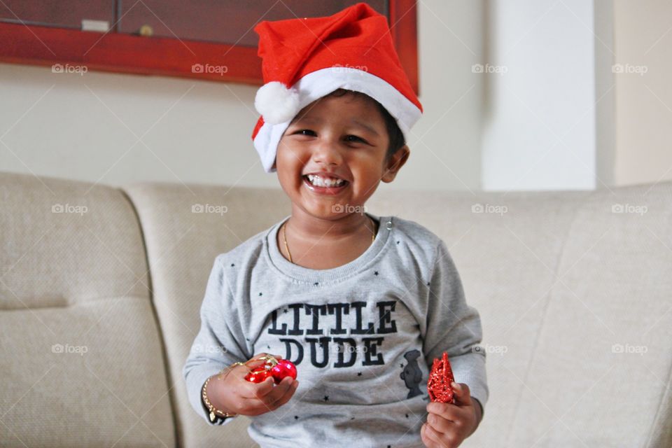 little baby playing with Christmas stars