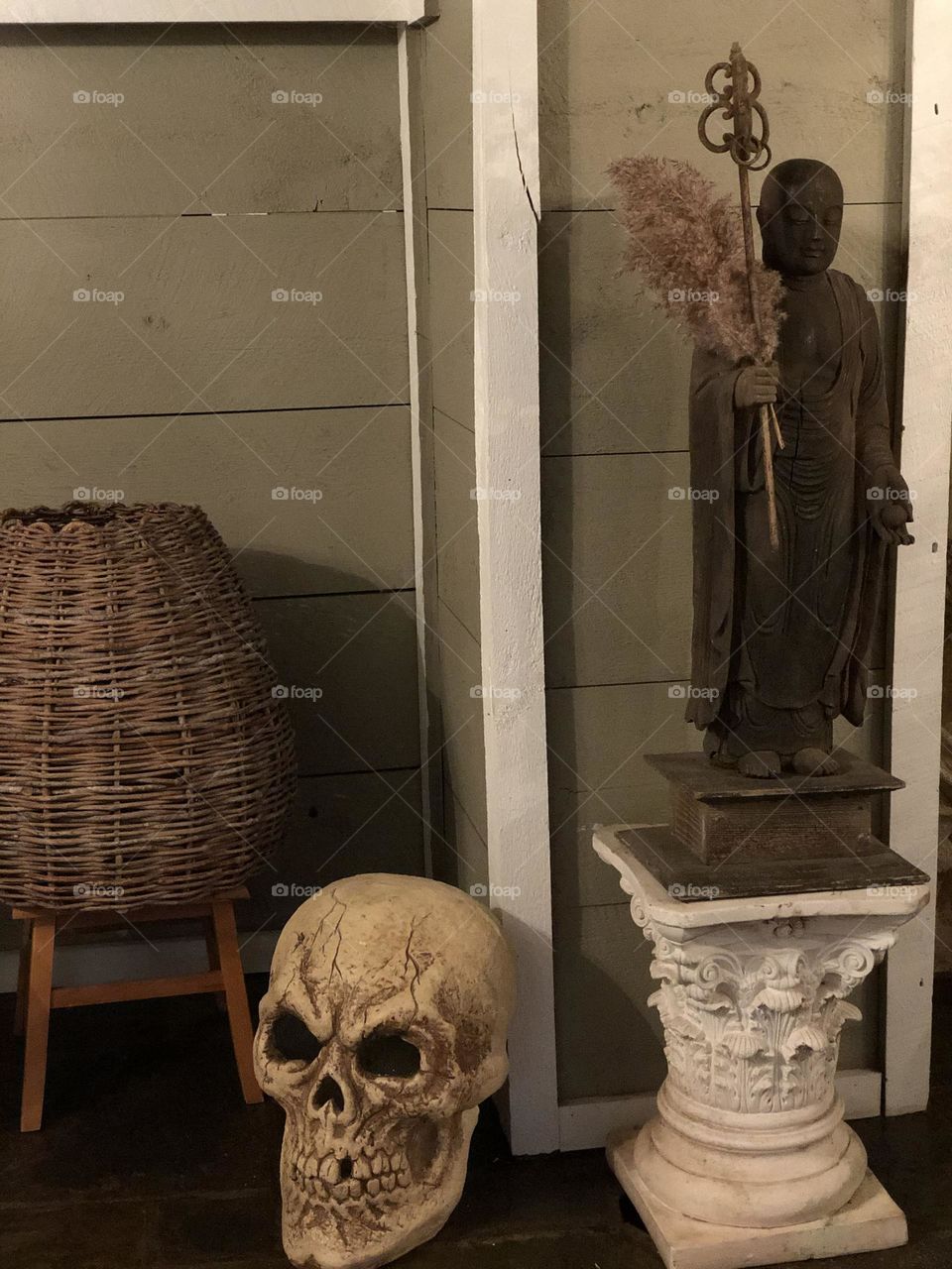 Skull in the corner, decorating for Halloween, realistic skull decoration, skull decor in your home, staying at a Bed and Breakfast Inn, creepy decorations 