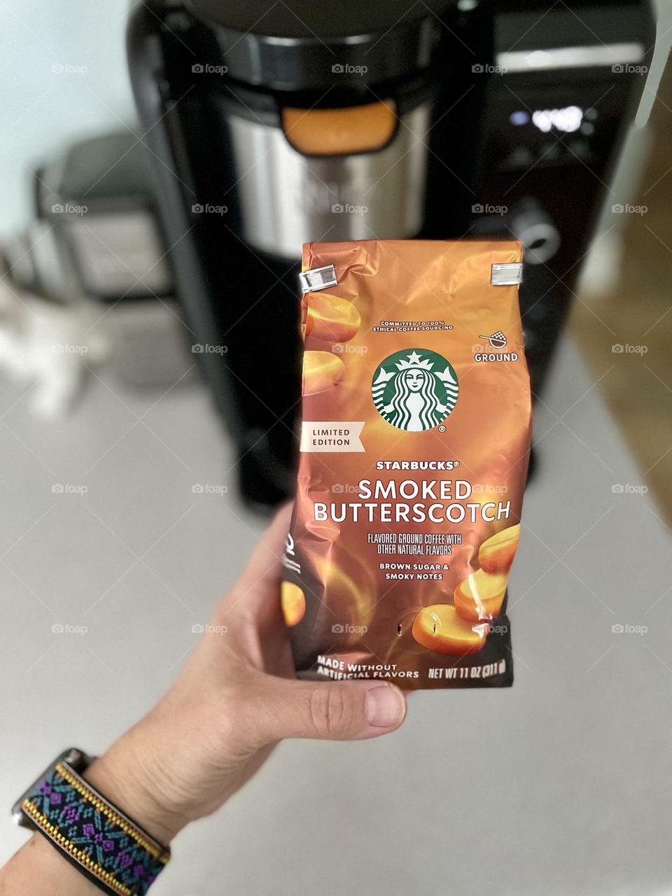 Woman holds bag of Starbucks coffee, smoked butterscotch Starbucks ground coffee, using the coffee maker at home, making cold brew at home, homemade coffee 