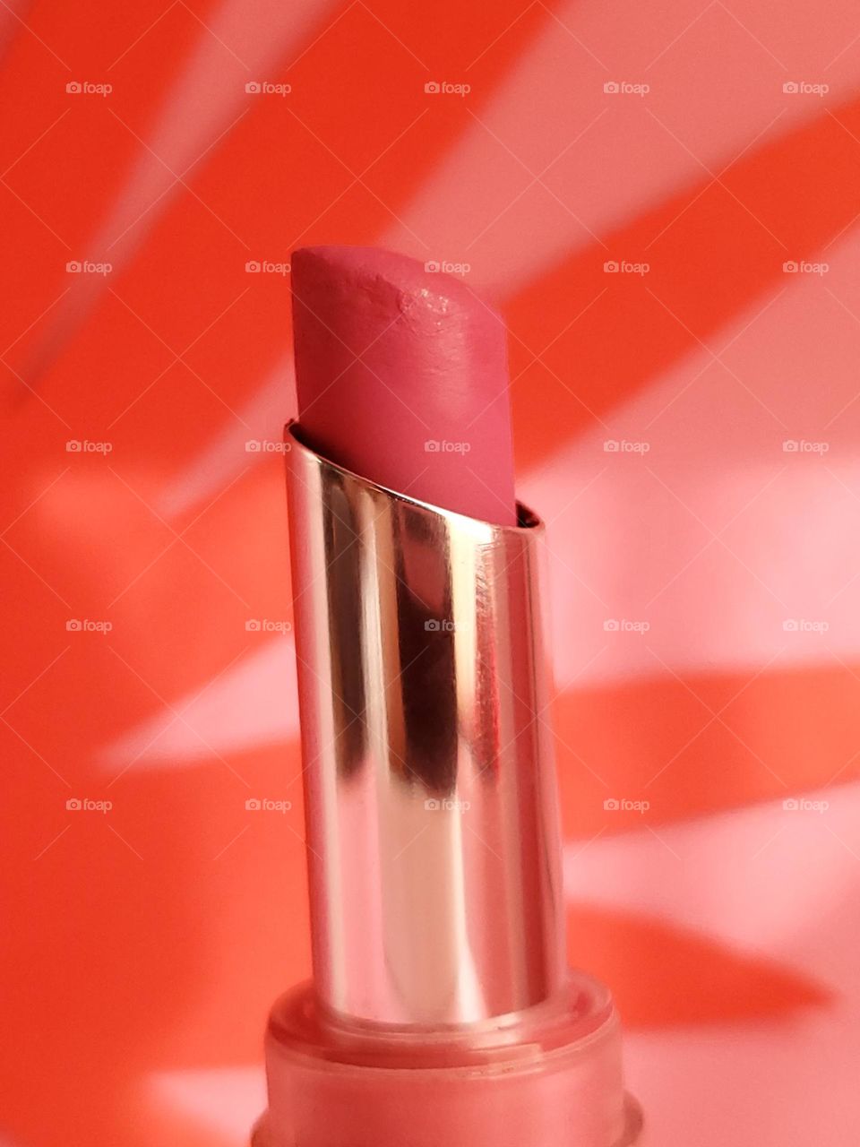 Pink matte 14 hour lipstick closeup.