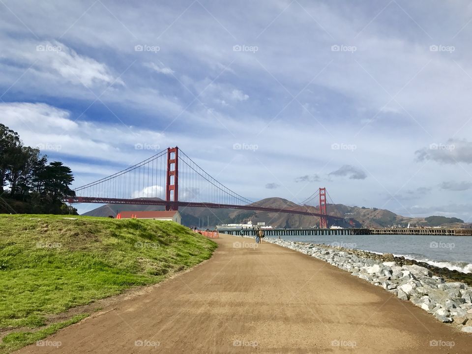 Approach to the Golden Gate Bridge, San Francisco. Approaching the Golden Gate Bridge. Impressive suspension bridge. Man made. Moody sky. 