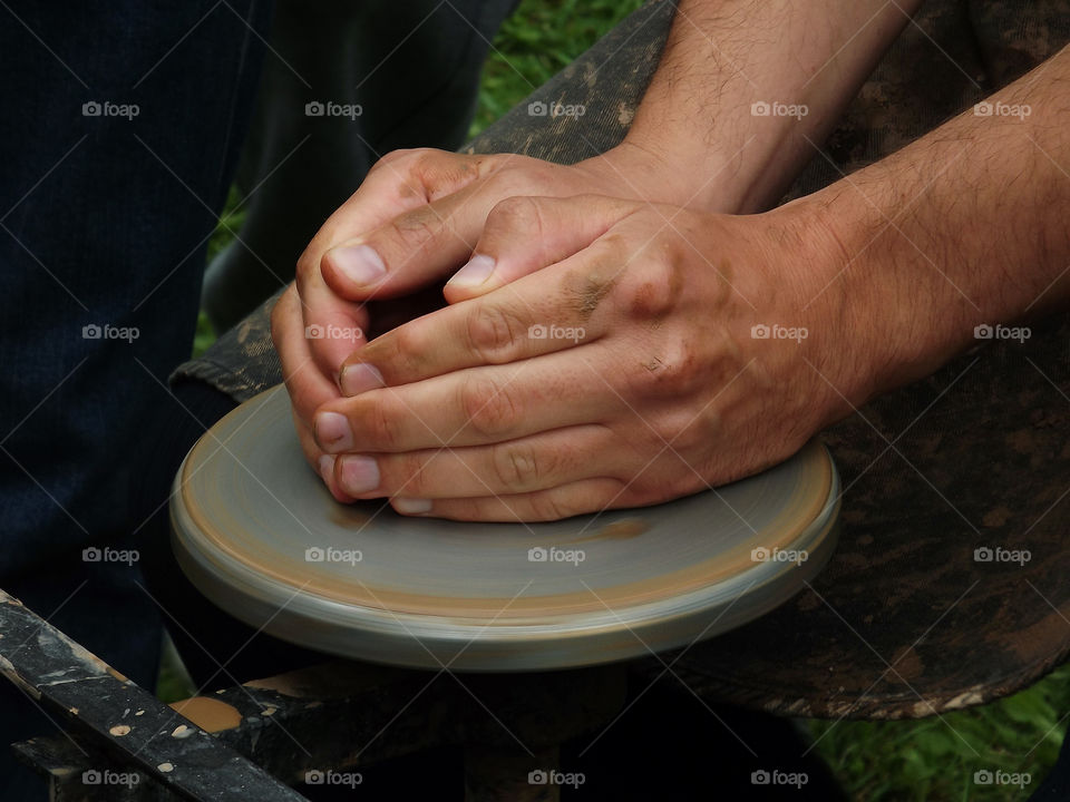 Persons making pottery