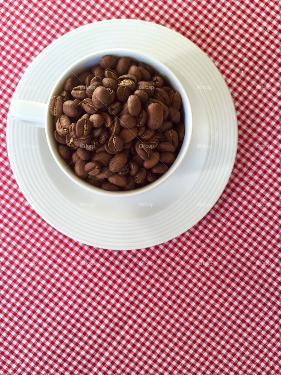 Coffee. Cup filled with coffee beans