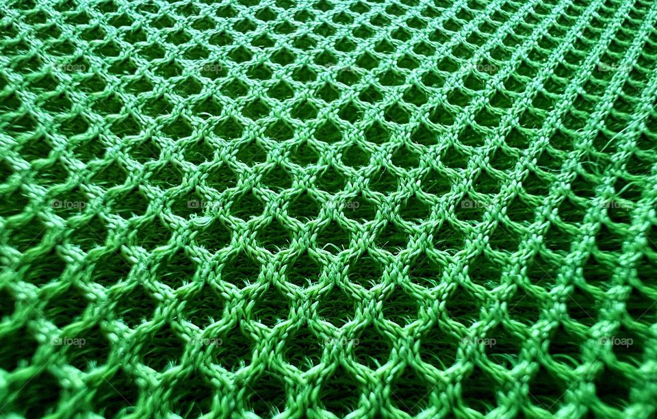 Green close up abstract futuristic mesh shape surface background