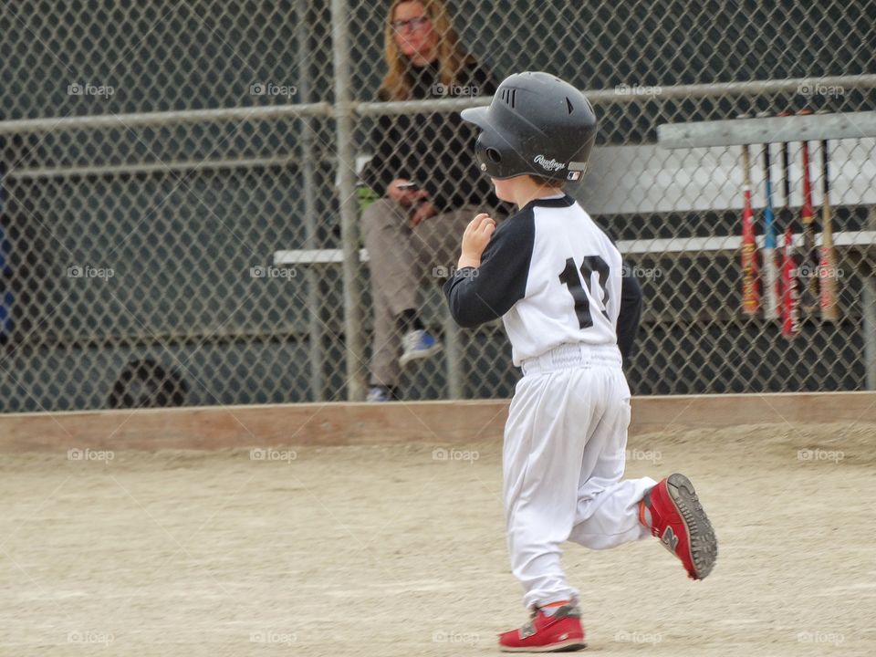 Young Baseball Player. Young Boy Running The Bases
