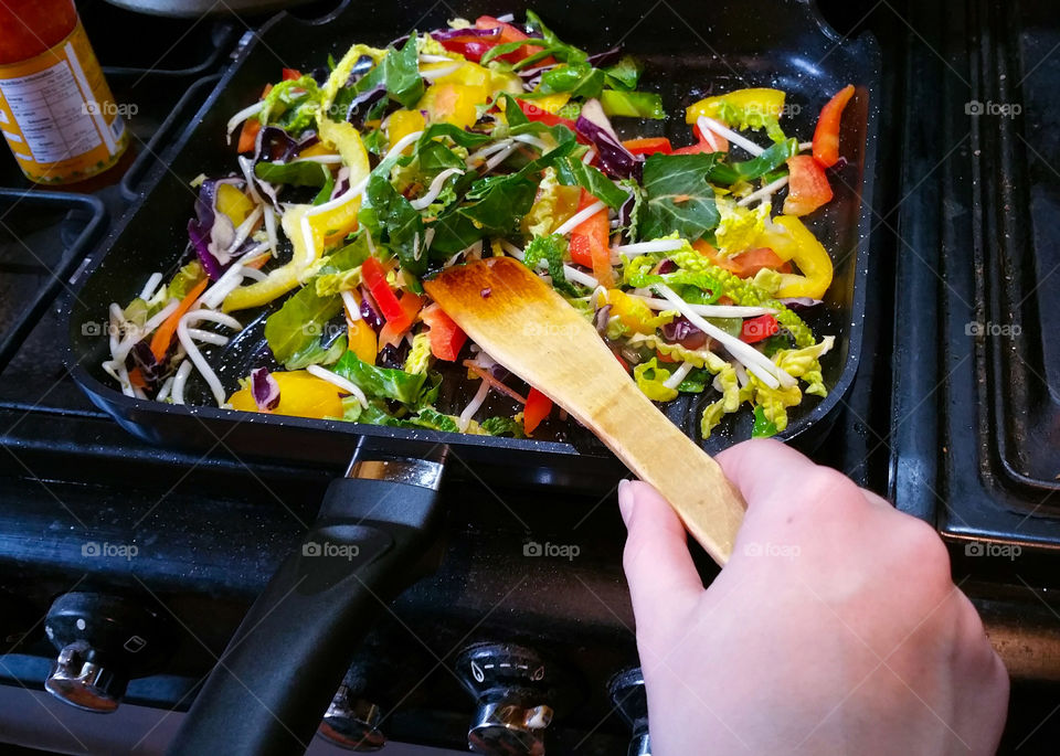 Cooking a vegetable stir fry with sweet chilli sauce