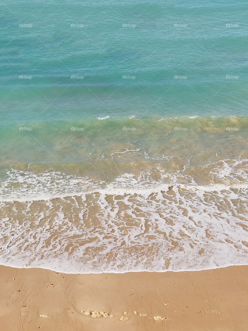 Beach waves crashing ashore 