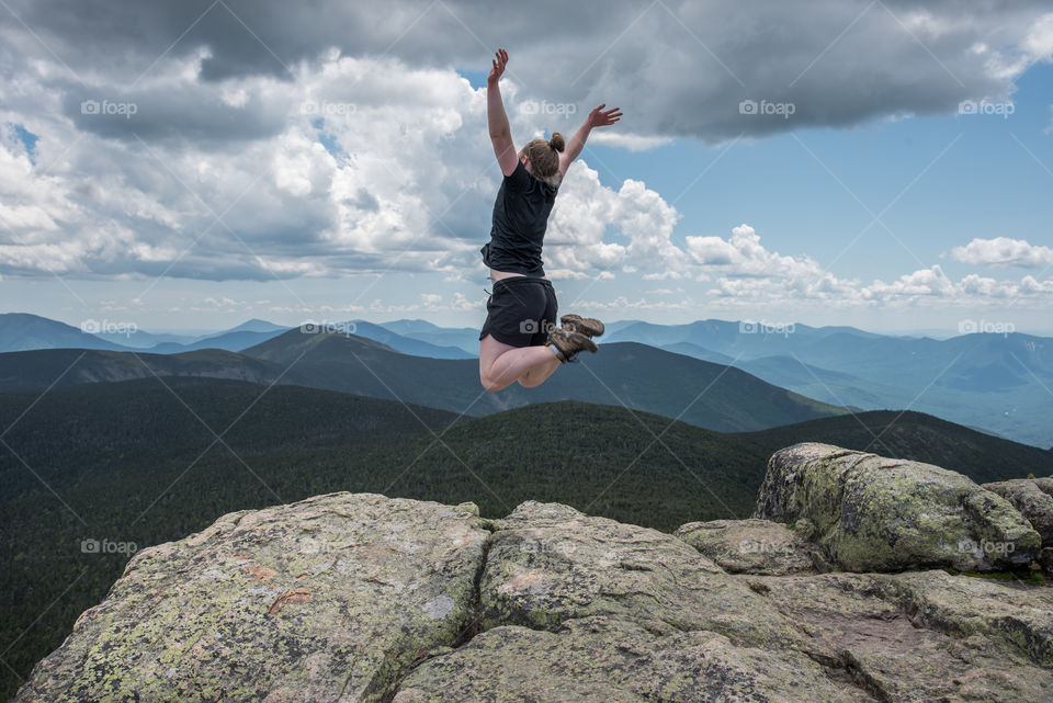Jumping for joy on the top of the mountain