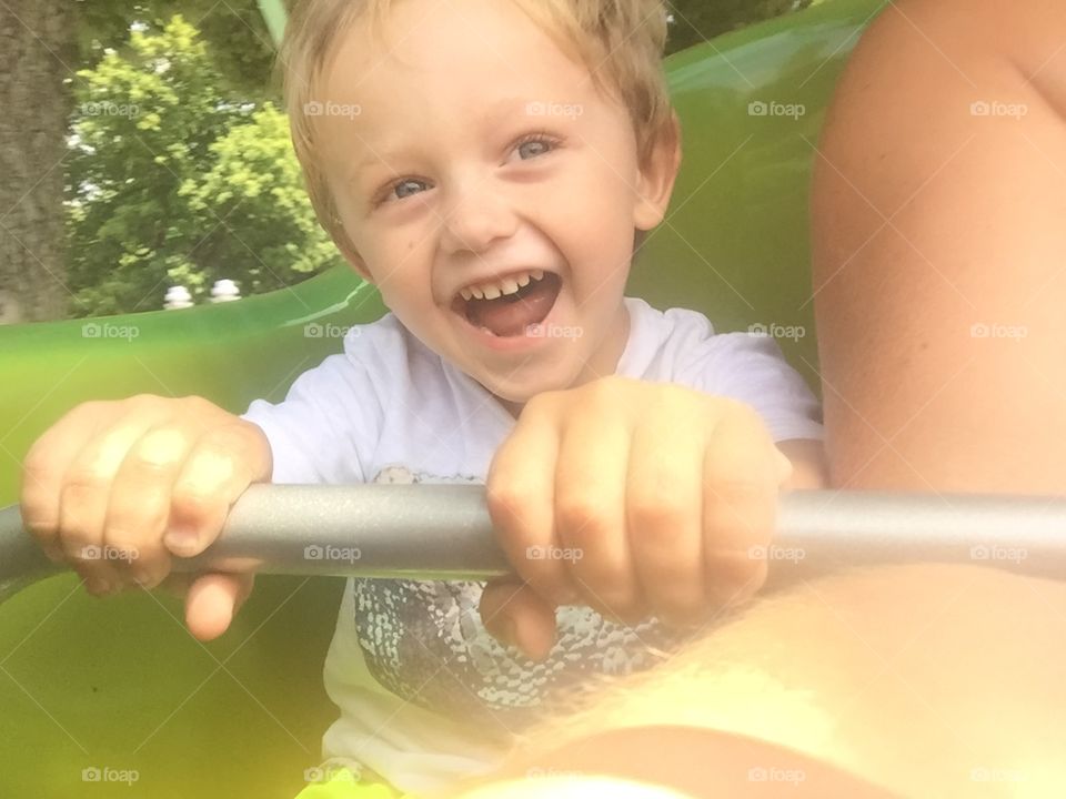 My son experiencing the thrill of a roller coaster for the first time. 