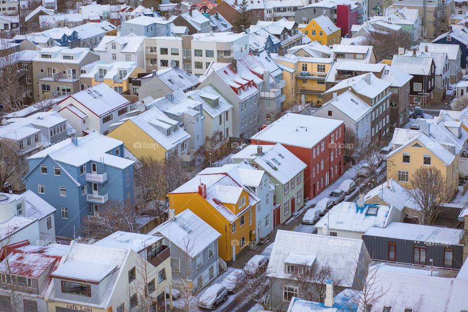 Aerial view of the central Reykjavik city in winter. Lovely colorful houses and streets covered by white snow. Iceland. Europe travel, winter holiday, vacation, trip.