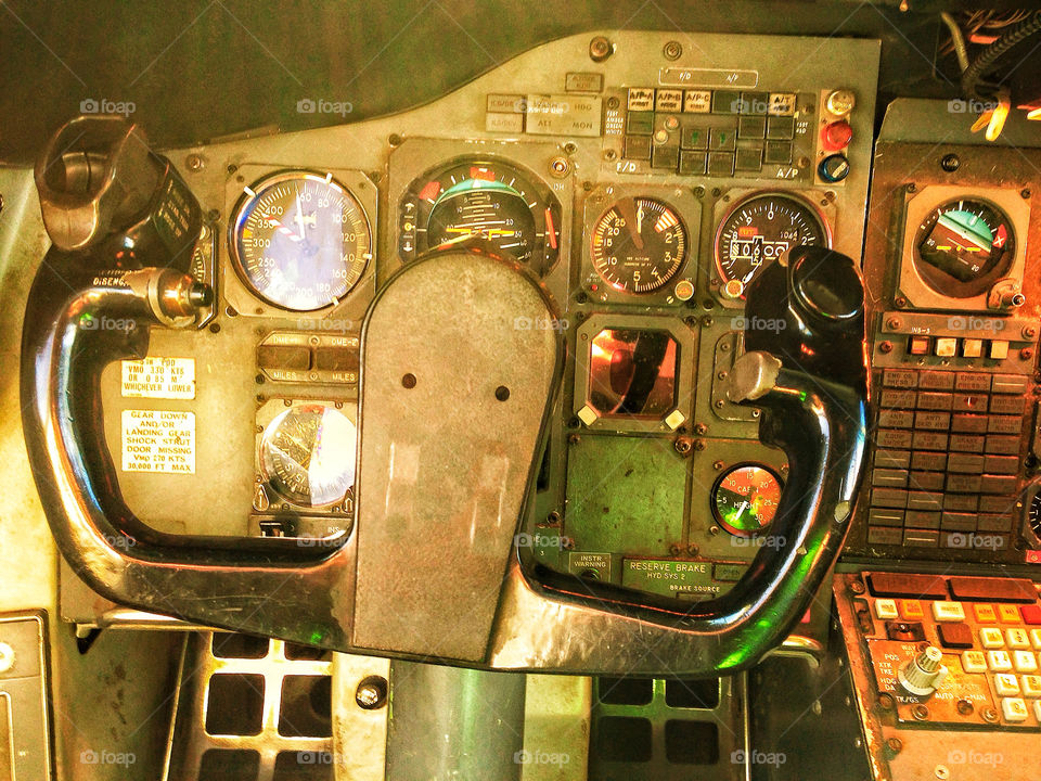 Control stick and instrument gauges in cockpit of 747 passenger
