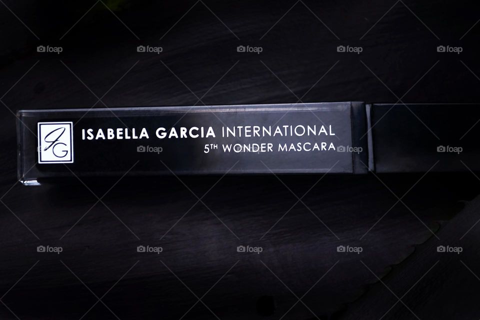 Black backdrop cosmetic beauty product Isabella Garcia international brand mascara display