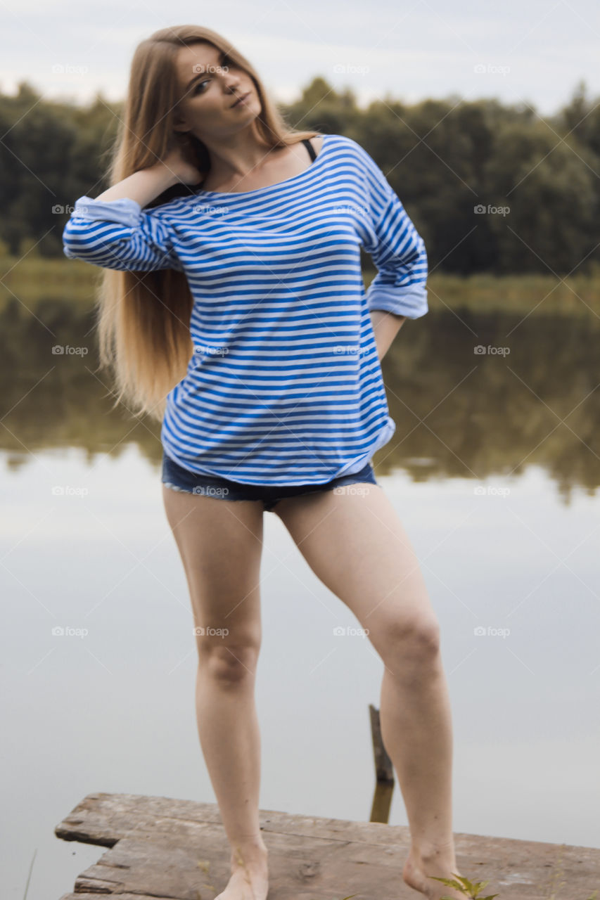 A girl with blond hair on the lake in a striped shirt and short denim shorts on the background of grass, reeds and an old wooden boat
Girl, woman, people, blonde, blonde hair, striped shirt, short shorts, denim shorts, shore, lake, grass, reeds, old boat, feelings, emotions, tenderness, love, lifestyle, lifestyle, vacation