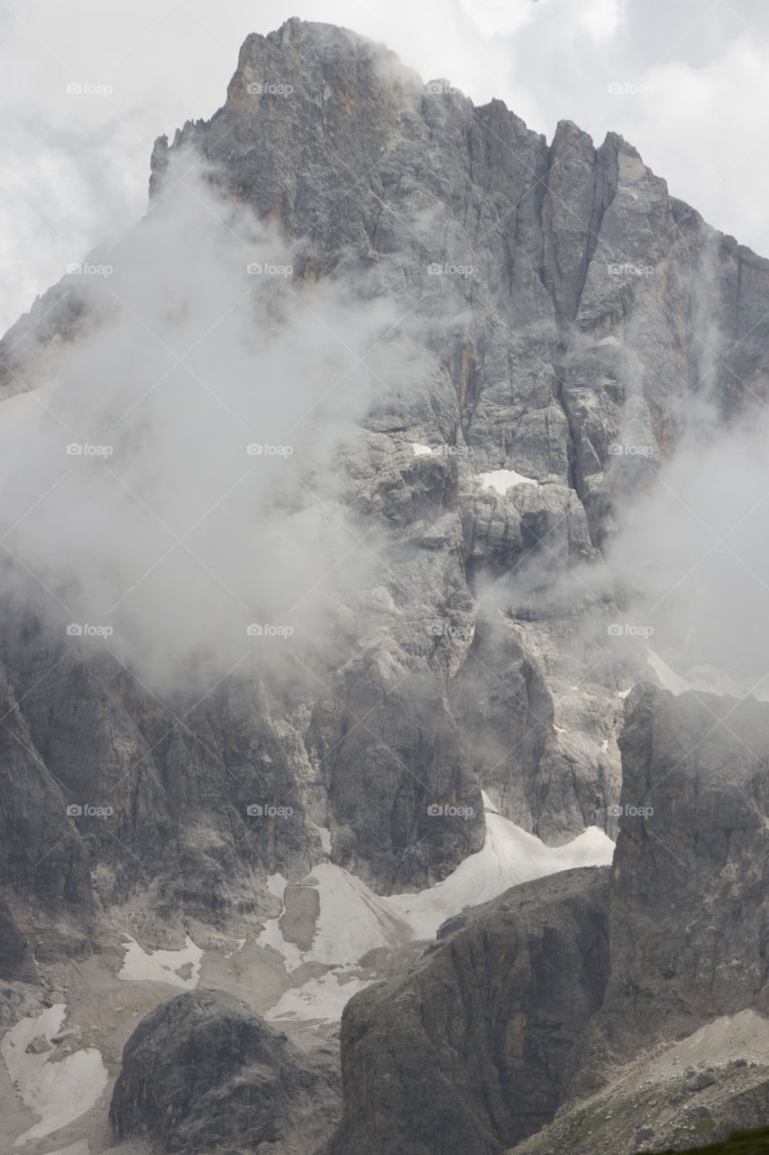 Grey high mountain peak - clouds